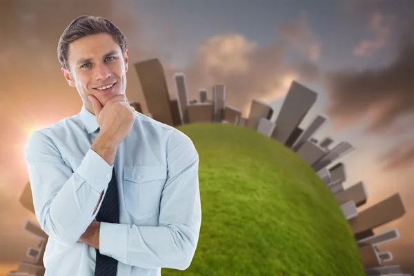 Thinking businessman with hand on chin — Stock Photo, Image