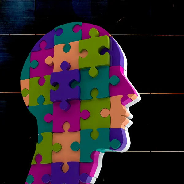 Head made of jigsaw pieces — Stock Photo, Image