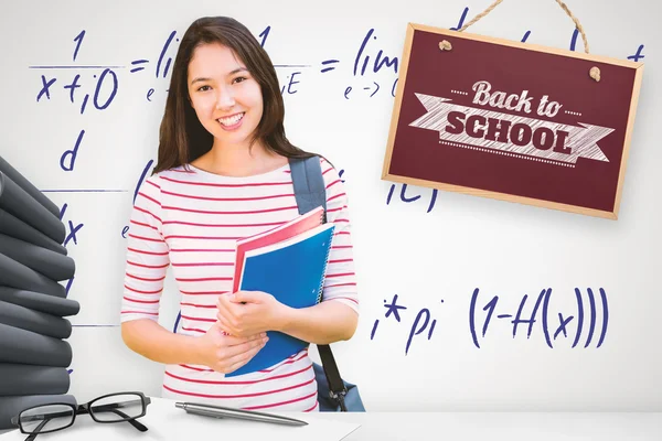 College girl holding books — Stock Photo, Image