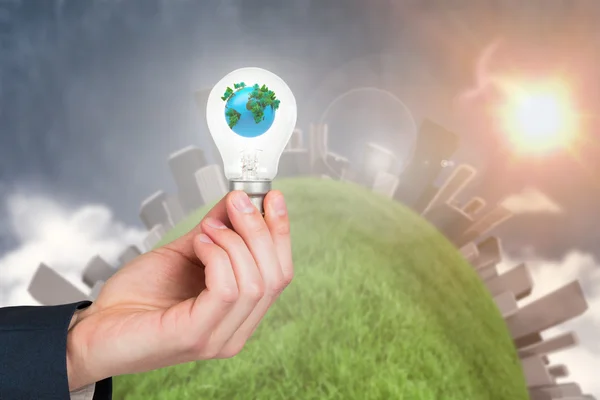 Hand holding environmental light bulb — Stock Photo, Image