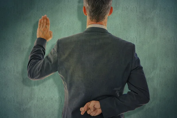 Businessman taking oath with fingers crossed — Stock Photo, Image