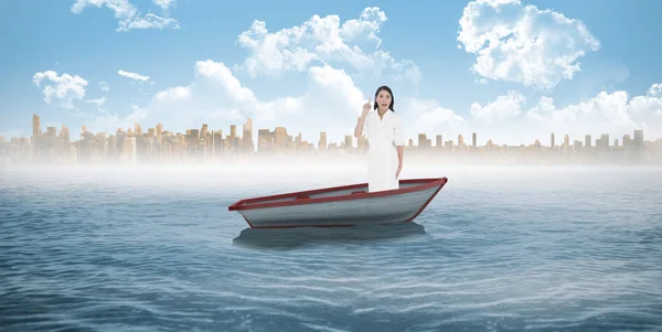 Woman posing against small boat — Stock Photo, Image