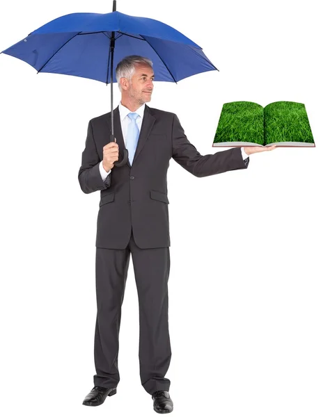 Man holding umbrella and lawn book — Stock Photo, Image