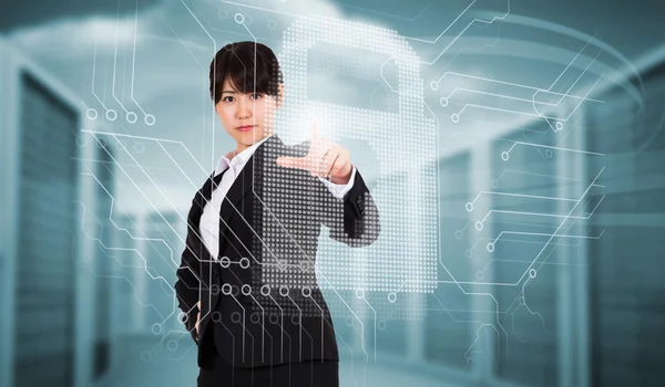 Businesswoman pointing against server towers — Stock Photo, Image