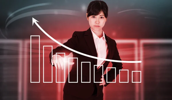 Businesswoman pointing against server towers — Stock Photo, Image