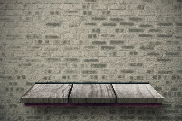 Mensola in legno contro muro mattoni — Foto Stock