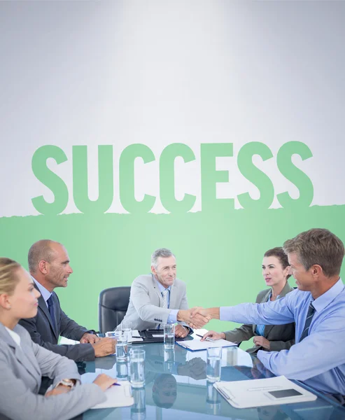 Imagem composta da equipe de negócios durante a reunião — Fotografia de Stock