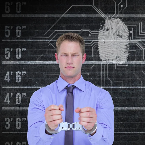 Businessman wearing handcuffs — Stock Photo, Image