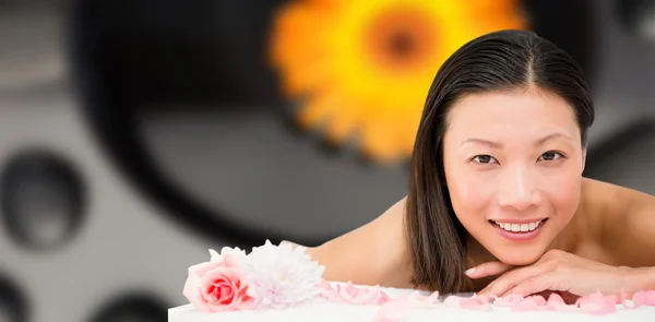 Relaxed woman lying on massage table — Stock Photo, Image