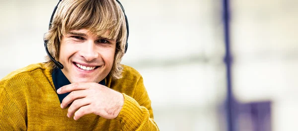 Businessman using headset — Stock Photo, Image