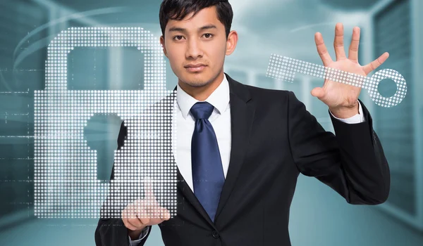 Businessman holding and pointing — Stock Photo, Image