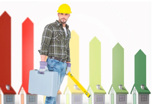 Manual worker with spirit level and toolbox — Stock Photo, Image