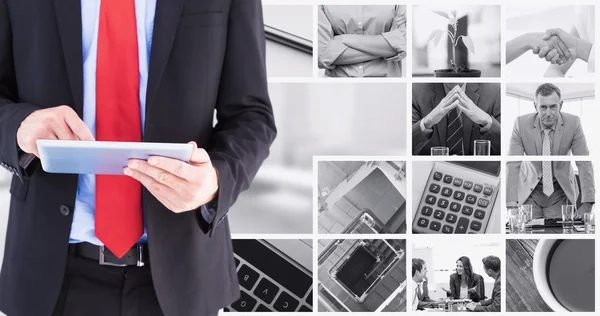 Samengestelde afbeelding van zakenman scrollen op zijn digitale Tablet PC — Stockfoto