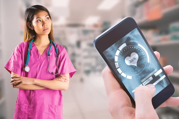 Asian nurse crossing arms — Stock Photo, Image