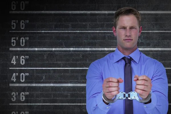 Businessman wearing handcuffs — Stock Photo, Image