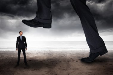 Businessman stepping against stormy weather clipart