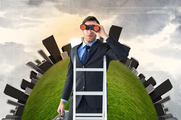 Businessman looking on ladder — Stock Photo, Image