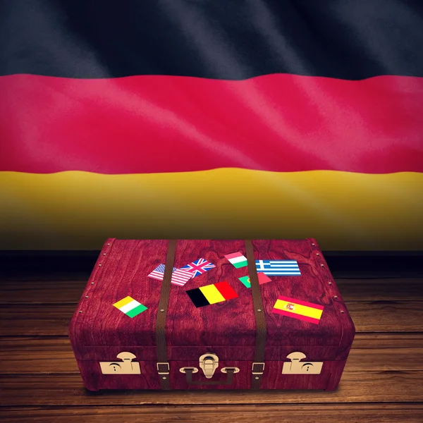 Suitcase with stickers and german national flag — 图库照片