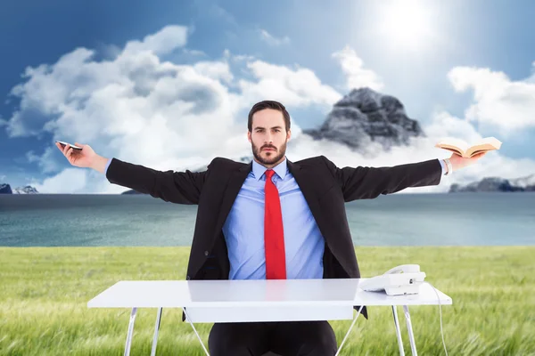 Businessman sitting with arms outstretched — Stock Photo, Image