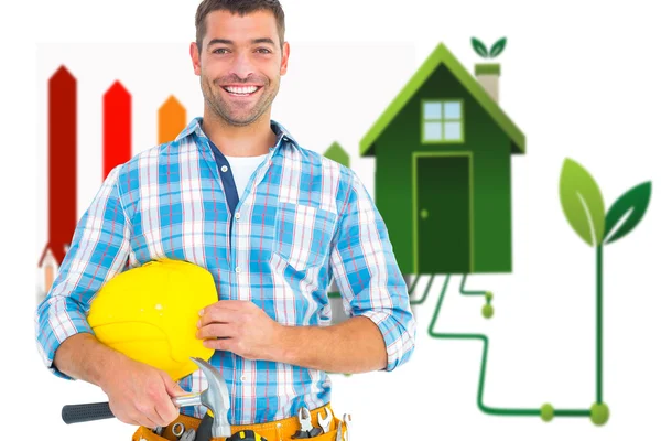 Handyman holding hardhat and hammer — Stock Photo, Image