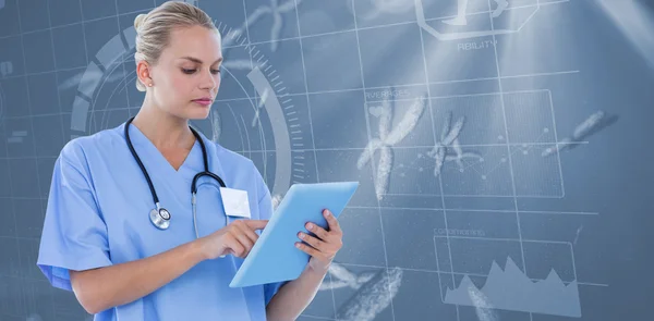 Serious doctor looking at clipboard Royalty Free Stock Photos