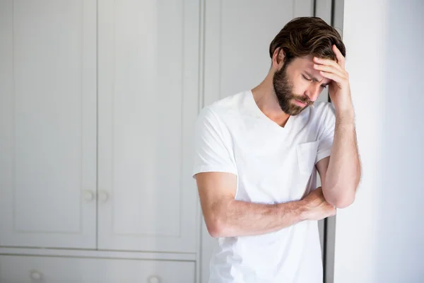 Worried man with hand on forehead — Stock Photo, Image