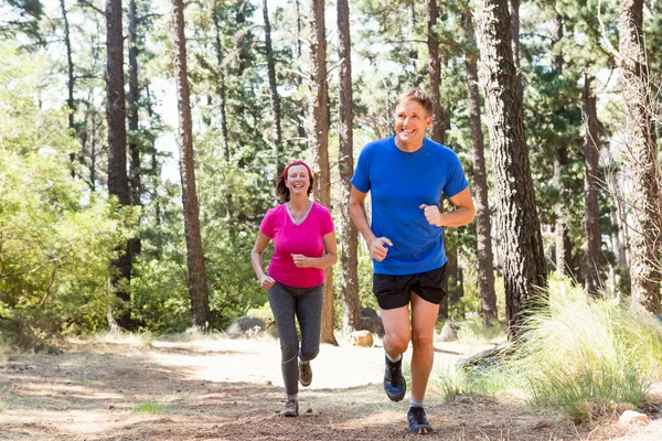 Couple smiling and running — Stock Photo, Image