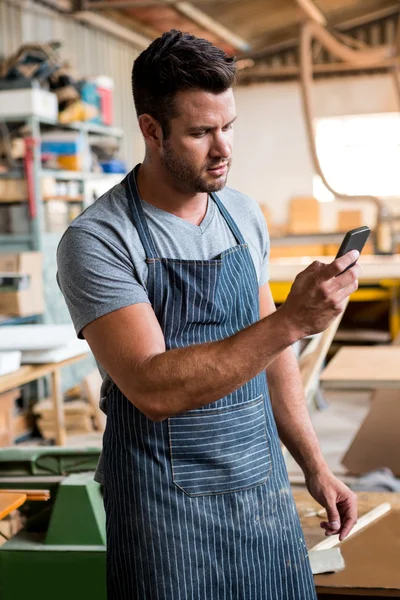 Carpenter on the phone — Stock Photo, Image