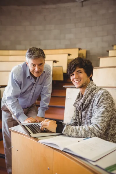Portrait of smiling student with professor — Stock Photo, Image