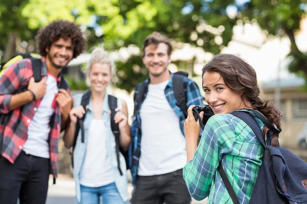 Woman taking photo of her friends — Stock Photo, Image