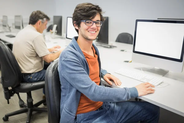 Portrait of happy student using computer — Stock Photo, Image