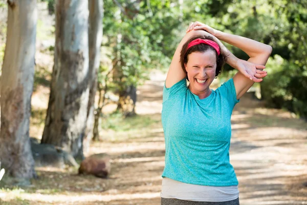 Woman stretching her arms — Stock Photo, Image