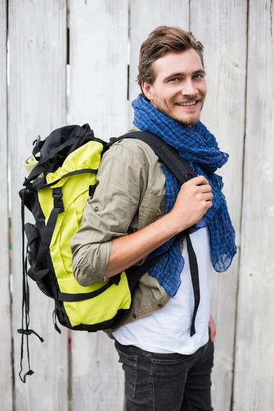 Young man carrying backpack — Stock Photo, Image