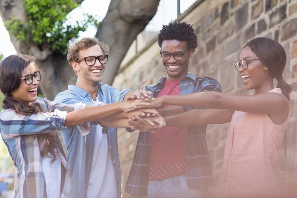 Friends putting their hands together — Stock Photo, Image