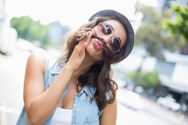 Young woman pulling funny faces — Stock Photo, Image