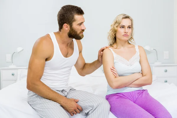 Young couple arguing on bed Royalty Free Stock Photos