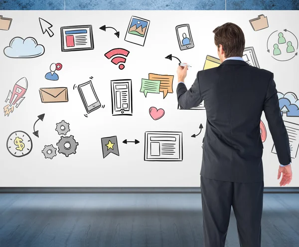 Businessman standing and writing with marker — Stock Photo, Image