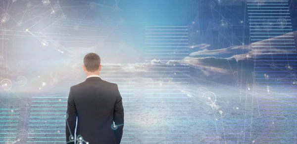 Businessman standing against hologram — Stock Photo, Image