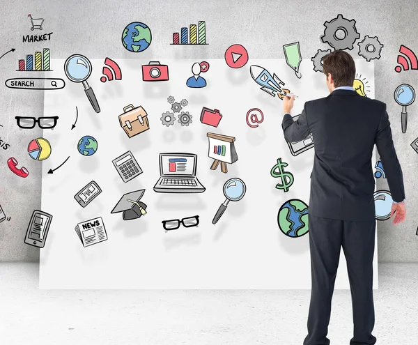 Businessman standing and writing with marker — Stock Photo, Image