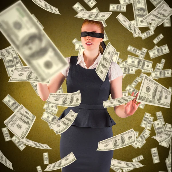 Businesswoman in blindfold and dollars in air — Stock Photo, Image