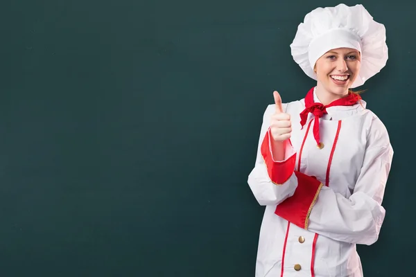 Pretty chef showing thumbs up — Stock Photo, Image