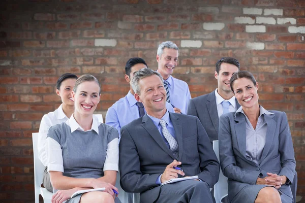 Young colleagues using laptop in a meeting — Stock Photo, Image