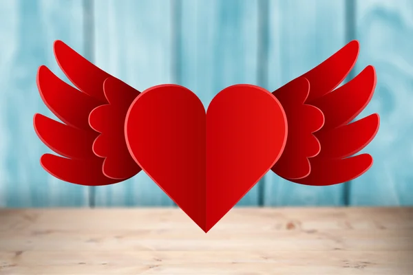 Composite image of heart with wings — Stock Photo, Image