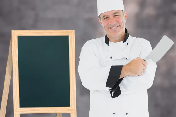 Uomo in uniforme chef azienda carne mannaia — Foto Stock