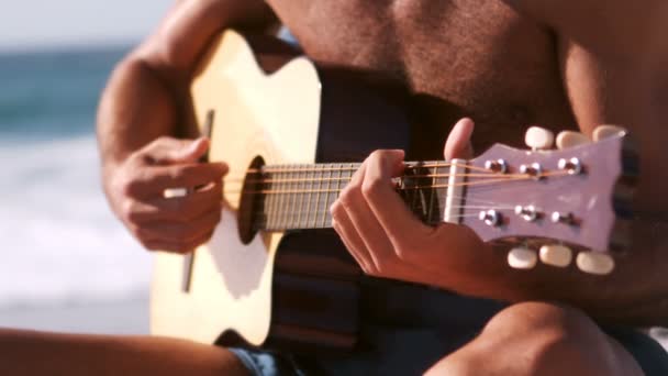 Man is playing with his guitar — Stock Video