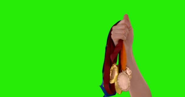 Mani che lanciano medaglie — Video Stock