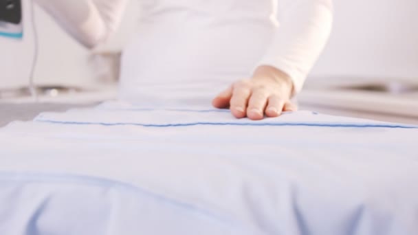 Woman doing the ironing — Stock Video