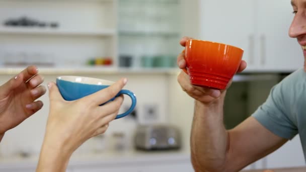 Couple cheering with a hot beverage — Stock Video