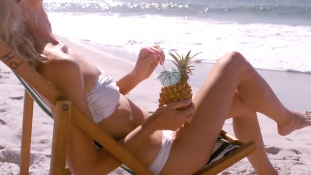 Woman is enjoying with a pineapple cocktail — Stock Video