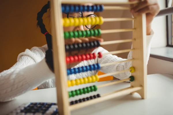 Schoolchild using a slide rule — Stock Photo, Image